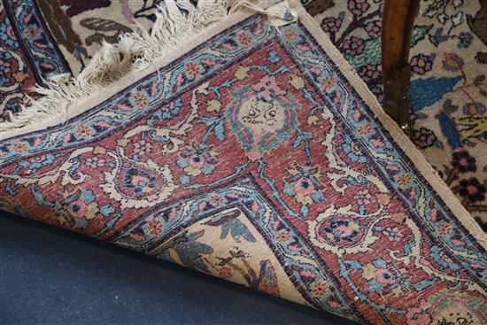 A North West Persian ivory ground rug, 6ft 3in by 4ft 10in.